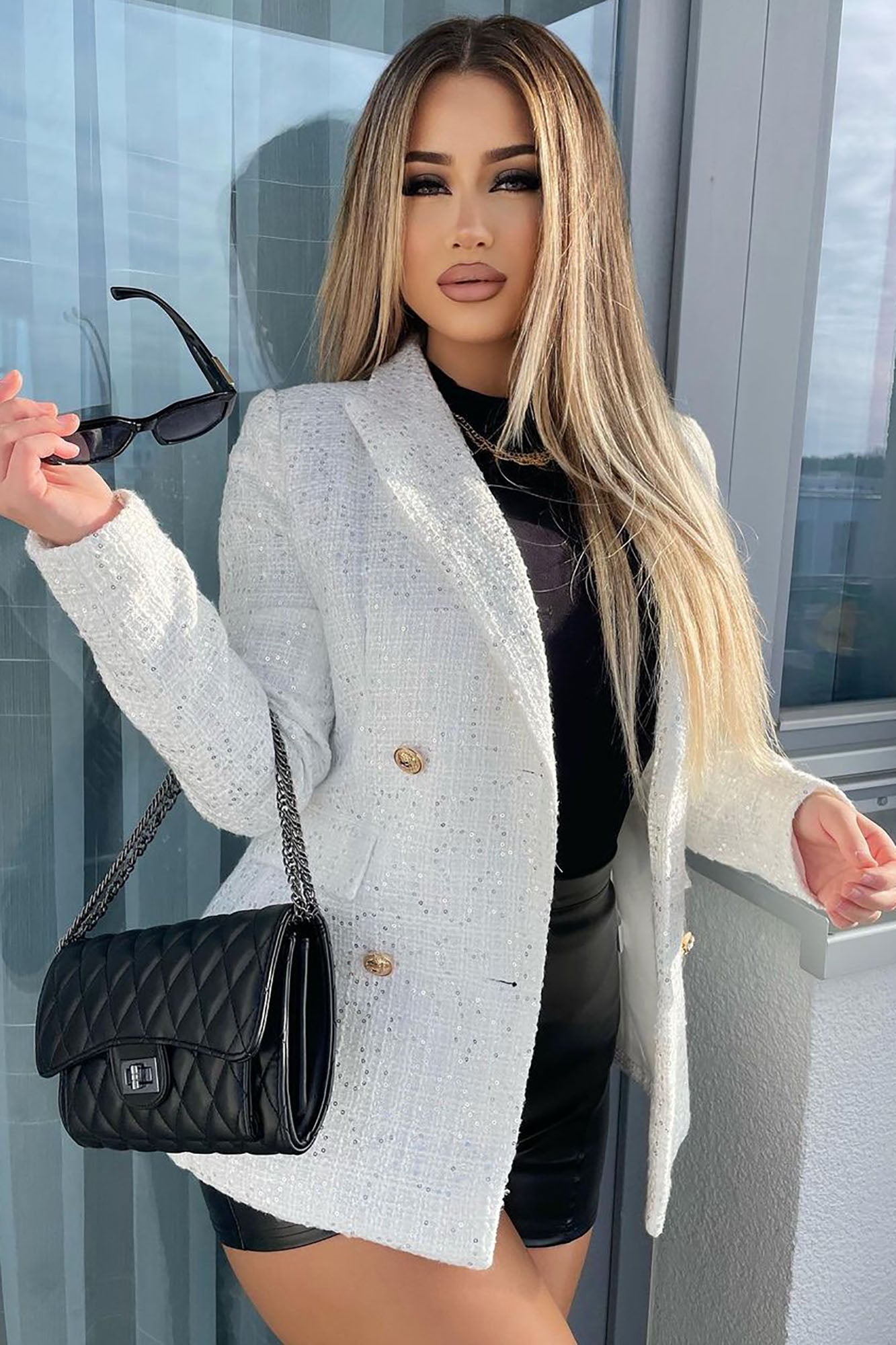 https://cdn.shopify.com/s/files/1/0293/9277/products/CushionTheBlowCrossbody-Black_MER.jpg?v=1640723698